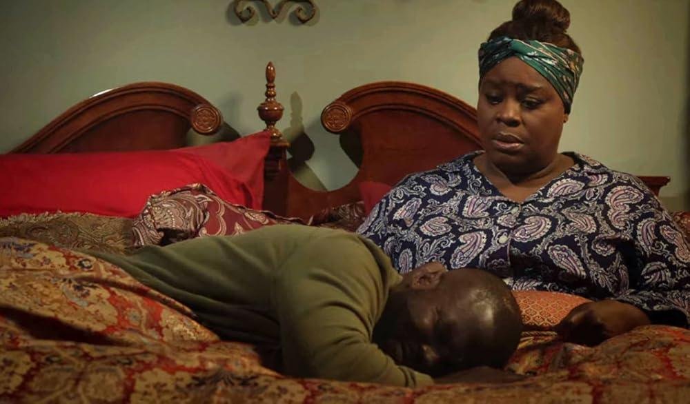 Femme africaine confrontée à un secret conjugal et au chantage financier